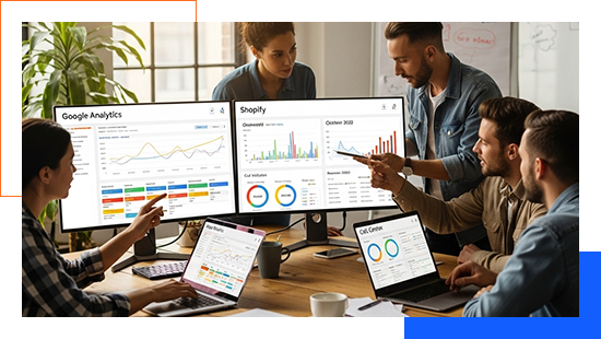 Professionals reviewing historical analytics data across multiple screens.