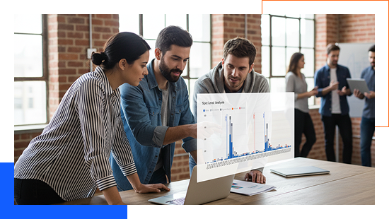 Group of professionals reviewing advertising data on a laptop.