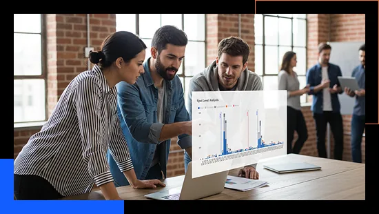 Group of professionals reviewing advertising data on a laptop.